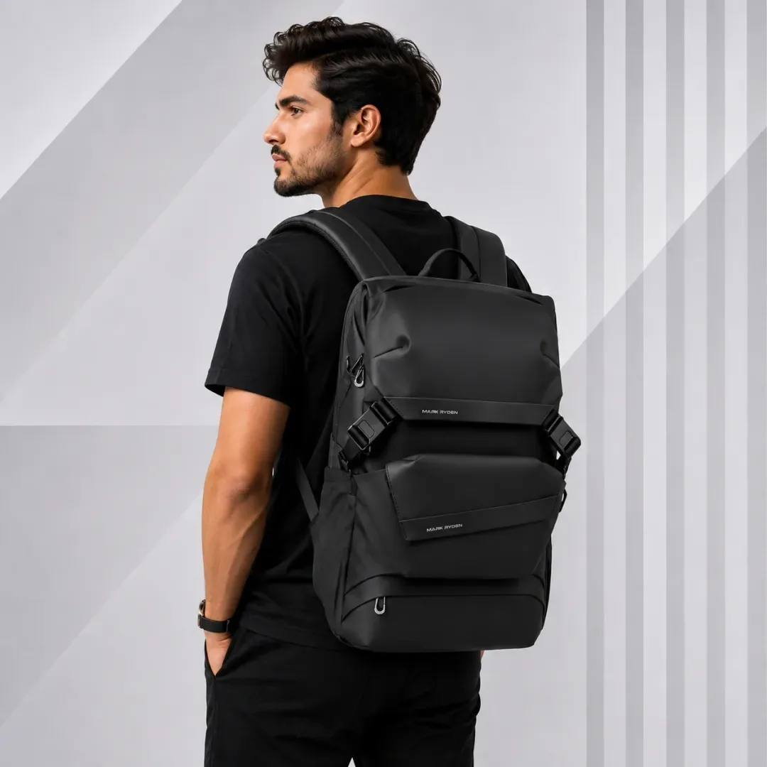 A man wearing the black Mark Ryden MR2859 laptop backpack on both shoulders